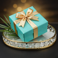 L'Essentiel bundle in a turquoise gift box with gold ribbon